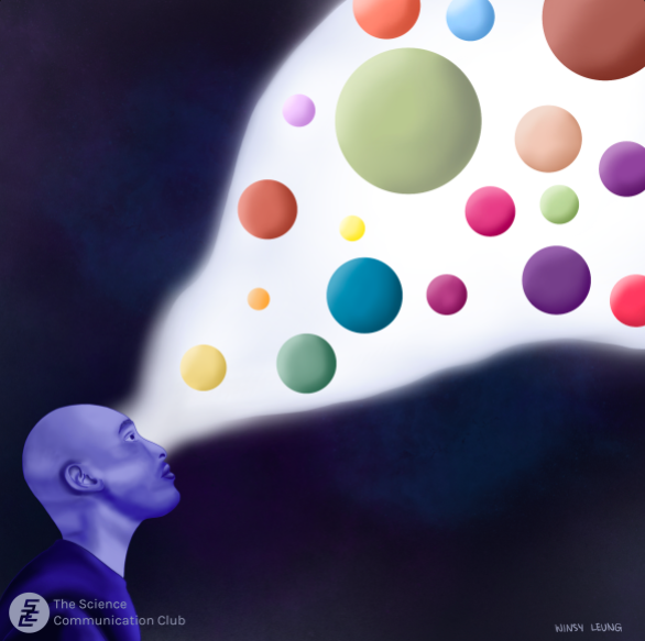 A man looking up and seeing different colour and size spheres through a beam of white light in a dark space.